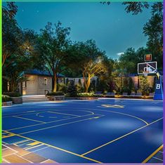 an outdoor basketball court is lit up at night with trees and bushes surrounding the area