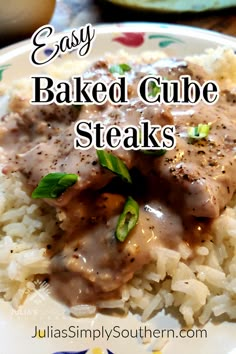 a plate with rice and meat covered in gravy on it, the title says easy baked cube steaks