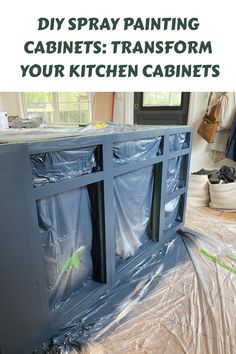 DIY spray painting cabinets in progress, transforming kitchen cabinets with a navy blue color. Tips For Spraying Cabinets, How To Spray Kitchen Cabinets, Kitchen Spray Paint Cabinets, How To Spray Paint Kitchen Cabinets, Paint Sprayer For Cabinets, Spray Painted Kitchen Cabinets, Spray Painting Cabinets, Diy Paint Sprayer