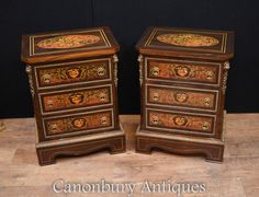 two wooden drawers with ornate designs on them, one is painted brown and the other is gold