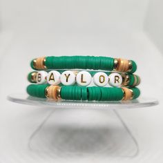 Custom to fit your wrist, this bracelet set is made to order in your size. This set comes with 3 bracelets as shown in the photos.  Let the world know that you or someone you love is or was a Baylor student. Adjustable Stacked Bracelets As Gift, Customizable Green Bracelet Jewelry, Custom Name Green Jewelry For Friendship, Customized Green Bracelet Jewelry, Customizable Green Bracelet For Personalized Gift, Adjustable Green Beaded Bracelets For Personalized Gift, Adjustable Green Beaded Bracelets For Gifts, Customized Adjustable Green Bracelets, Customized Adjustable Green Bracelet