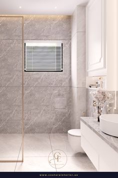 a modern bathroom with marble walls and floor