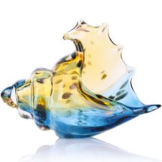 a glass figurine that is shaped like a fish