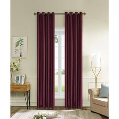 a living room with a couch, chair and window covered in maroon drapes