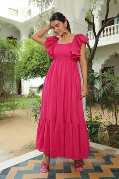 Berry Pink Flared Maxi Dress is a beautiful and stylish choice for women with Indian body type who want to make a statement. With customization options, free shipping, and easy returns, you can shop with confidence and look your best in this stunning dress. Chic Cotton Maxi Dress With Ruffle Hem, Feminine Cotton Maxi Dress With Ruffles, Pink Cotton Ruffle Dress For Summer, Pink Cotton Ruffle Dress With Ruffle Hem, Feminine Cotton Midi Dress For Party, Elegant Cotton Maxi Dress With Ruffles, Pink Cotton Dress With Ruffles, Pink Ruched Dress With Ruffle Sleeves, Elegant Pink Cotton Midi Dress