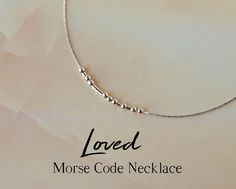 "This delicate sterling silver necklace spells the word \"Loved\" in Morse code, as a secret reminder of a loving bond. A meaningful piece of jewelry that will make a delightful gift for any of your loved ones, friend or family! The word \"Loved\" is spelled in Morse code using round sterling silver beads representing the dots, and sterling silver tubes as the dashes. The necklace will come with a card displaying the message in both Morse code and English. ABOUT THE MATERIALS: - The sterling sil Secret Message Jewelry, Code Morse, Morse Code Necklace, Message Necklace, Necklace For Mom, Morse Code Bracelet, Hidden Message, Jewelry Dainty, Handmade Jewelry Tutorials