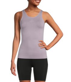 From Modern Movement, this tank features:Solid, soft micro fabricationV-neckline & scoop neckline sleevelessTank strapsReversible neckline Straight hemlinePullover constructionNylon/spandexMachine wash/tumble dry Imported. Athleisure Sleeveless Seamless Camisole, Compressive Sleeveless Tank Top For Spring, Seamless Tank Camisole In Athleisure Style, Seamless Stretch Tank Vest, Athleisure Stretch Camisole With Scoop Neck, Casual Seamless Sleeveless Tank Top, Seamless Nylon Tank Top With Medium Support, Stretch Seamless Vest With Tank Straps, Seamless Stretch Vest With Tank Straps