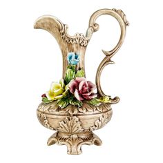 an ornate vase with flowers in it on a white background and the letter s is made out of wood