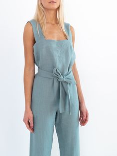 "DAKOTA is a sleeveless jumpsuit with belt. DETAILS - Tank style top - Sleeveless design - Zip closure at the back - Self tie belt - 100% midweight European linen fabric - Cut and sewn to order just for you in our studio COLOR - Dark turquoise, you can also choose other colors above - Fabric samples are available here https://www.etsy.com/listing/586569696/linen-fabric-samples SIZING & FIT - Fits true to size - Inseam is approximately 27 inches / 68.5 cm - Bust is approximately 21 inches / 4 Fitted Belted Sleeveless Jumpsuits And Rompers, Sleeveless Belted Jumpsuit For Work, Belted Sleeveless Jumpsuits And Rompers For Work, Sleeveless Workwear Jumpsuit With Tie Waist, Fitted Sleeveless Jumpsuit With Belt Loops, Fitted Jumpsuits With Belt For Spring, Fitted Jumpsuits And Rompers With Belt For Spring, Jumpsuit With Belt, Linen Overalls