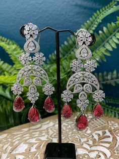 Rhodium plated earring with Cz stone work. About 4 inch long . American diamond push back super light weight. Carved stone detail. Clip back Carved Stone, Cz Earrings, Stone Work, American Diamond, Stone Carving, Cz Stone, Cherry Red, Blue And Silver, Rhodium Plated