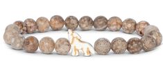 a bracelet with brown beads and a white giraffe figurine on it