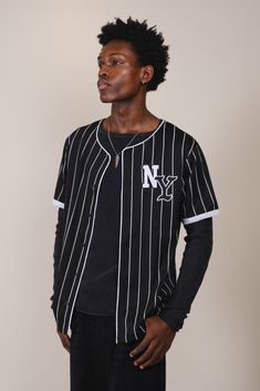 NY Pinstripe Baseball Jersey
#color_black Wide Legs Jeans, Curved Back, Jogger Shorts, Wide Legs, Baseball Jersey, Baseball Jerseys, Mens Outerwear, Hoodie Top, Black Media