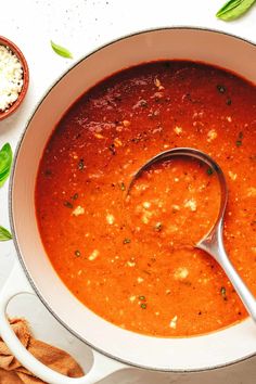 a bowl of soup with a spoon in it