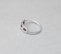 Ring handmade from sterling silver and threaded with red waxed cord. You can choose the colour of the cord. Although waxed cord is very durable even if washed, avoiding water will prolong the ring's life. You can thread another cord to replace it. I will send extra cord with each order in any case as part of the wrapping. :) This ring is made to order; please make sure you choose your size. Convo me if your size is not available. Feel free to ask me if you don't know which is the right size for Red Minimalist Ruby Promise Ring, Handmade Adjustable Red Ruby Ring, Handmade Minimalist Red Rings, Modern Red Ruby Ring In Sterling Silver, Minimalist Red Ruby Ring, Red Minimalist Promise Ring, Minimalist Red Promise Ring, Adjustable Open Ring In Red, Adjustable Open Red Ring