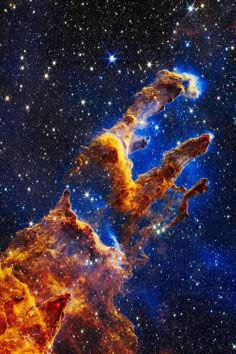 an image of the star forming region in space, with stars all around it and blue sky