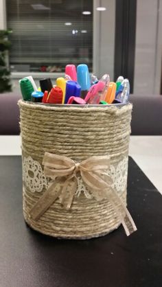 there is a basket with many pens and markers in it