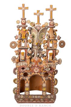 an ornate clock with three crosses on it