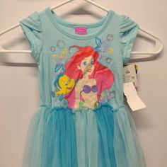 Nwt! 12-Month Dress Featuring Disney's Ariel The Little Mermaid - Brand New With Tags And In Excellent, Gift-Giving Condition. All My Items Come From A Clean, Smoke Free Home. Have Questions? Need Measurements? Please Ask, I'm Happy To Help! Like What You See? Please Feel Free To Bundle Any Of My Items Together And I Will Make You An Offer! Blue Summer Mermaid Dress For Dress-up, Blue Mermaid Dress For Summer Dress-up, Blue Mermaid Dress For Summer Events, Fitted Cotton Disney Dress, Cute Blue Princess Dress With Short Sleeves, Blue Short Sleeve Cute Princess Dress, Fitted Character Print Dresses For Spring, Spring Fitted Dresses With Character Print, Fitted Spring Dresses With Character Print