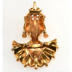 This Reinad Asian Princess fur clip brooch is much more detailed in the design and construction than many others by this company and likely sold at a higher price point when it was new. It has bright, unworn gold plating and rhinestones in two hues of purple along with clear accents. Marked Reinad on the back. Dates to around 1940. Measures about 3 3/4" long and 2 1/2" wide. Condition is excellent with only minor wear to the red paint on the lips. A very dimensional piece of collectible costume jewelry that looks amazing when worn. Gold Jeweled Brooches For Formal Occasions, Formal Gold Jeweled Brooches, Victorian Jeweled Gold Brooches, Victorian Gold Brooches For Evening, Ornate Jeweled Gold Brooches, Ornate Gold Jeweled Brooches, Ornate Gold Brooches For Evening, Gold Brooches With 17 Jewels For Evening, Elegant Gold Jeweled Brooches