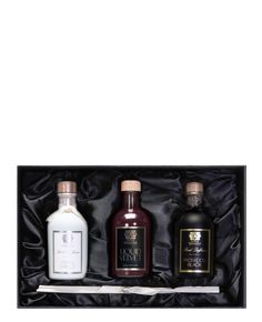 three bottles of liquor in a black box