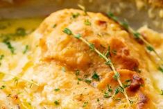 a close up view of some food in a pan with parsley on the top