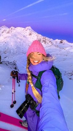 a woman is taking a selfie with her skis