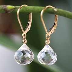 "Handmade dangle earrings feature Natural Rock Crystal in an onion cut shape. Classy, versatile gemstone earrings will add dainty yet colorful accents to your look, enhance your mood, and are suitable for everyday wear. Limited edition. The matching necklace is coming soon! DETAILS: * natural rock crystal * dangling from leverbacks * 14k Gold Filled (yellow or rose) or Sterling Silver * beautiful branded gift box * inspirational card about rock crystal SIZE: * Rock Crystals: 10 mm * earrings fro Cheap Adjustable Crystal Earrings With Faceted Beads, Elegant Faceted Briolette Crystal Earrings, Elegant Briolette Faceted Crystal Earrings, Elegant Briolette Crystal Earrings, Mystic Quartz, Earrings Handmade Dangle, Crystal Dangle Earrings, April Birthstone, Natural Rock