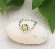 Brighten your day with the sparkly beauty of this unique flexible chain ring boasting a pineapple-cut peridot center. From Margo Manhattan. Peridot Jewelry, Peridot Ring, Chain Ring, I Love Jewelry, Brighten Your Day, Metal Working, Jewelry Rings, Chain, Sterling Silver