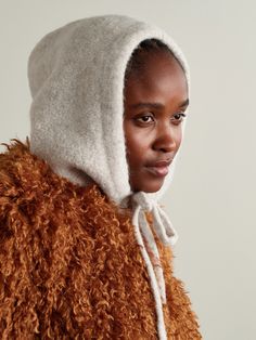 Isabel Marant's hood is a great layering piece that adds both warmth and visual interest to an outfit. Knitted with wool and alpaca threads, it's brushed for a super cozy handle and finished with a leather logo patch. Adjust the drawstring to get your preferred shape. Winter Wool Hoodie With Drawstring Hood, Cozy Beige Bonnet For Fall, Warm Wool Bonnet For Fall, Cozy Soft Knit Bonnet For Fall, Cozy Wool Bonnet For Winter, Fall Cozy Knit Bonnet, Cozy Knit Bonnet For Fall, Pink Holiday, Knitted Hood