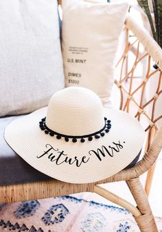 a white hat sitting on top of a chair