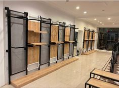 an empty room with wooden shelves and metal shelving