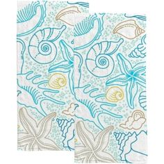 two napkins with blue and yellow designs on them, one has an image of fish