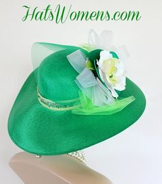 Ladies Kelly Green Wide Brim Formal Fashion Kentucky Derby Hat With Expensive Silk Millinery Flowers. This Custom Made Women's Designer Hat Is Embellished With A Large Kelly Green Crinoline Horsehair Bow, Mixed With A Lime Green Organza Bow. Beautiful Silk Handmade White, Lime And Kelly Green Flowers Are Placed In The Center Of This Bow.  A Hand Dyed Beaded Lime Green Velvet Trim Encircles The Crown Of This Fashion Hat. This Gorgeous Designer Hat Is Suited For A Bride To Be On Her Wedding Day, H Fitted Green Hat Band For Kentucky Derby, Green Fitted Hat Band For Kentucky Derby, Fitted Green Hat Bands For Kentucky Derby, Brimmed Top Hat For Wedding, Elegant Green Wide Brim Sun Hat, Adjustable Green Mini Hat For Wedding, Adjustable Green Costume Hats And Headpieces For Wedding, Adjustable Green Top Hat, Ceremonial Mini Hat With Curved Brim