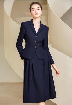 Look graceful and timeless in this two-piece chic midi skirt suit. With an elegant full skirt and tailored jacket, you'll feel timelessly elegant and sophisticated—perfect for work, special occasions, and everything in between. Make a statement in this beautiful skirt suit. Blazer and Full Midi Skirt V-Neck, Long sleeves Flap Pockets Structured shoulders. Polyester 100% Lining: Polyester 100% Imported Brand -Aision Model Number - 233017C1, 233017S2 Classic Luxury Skirt For Daywear, Luxury Classic Skirt For Daywear, Luxury Workwear Skirt With Buttons, Luxury Voluminous Skirt For Workwear, Suit Midi Dress, Luxury Workwear Skirt With Box Pleat, Luxury Designer Skirt For Workwear, Luxury Midi Dress For Workwear, Luxury Classic Pencil Skirt For Workwear