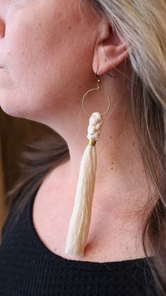 Macrame Tassel Gold Hoop Statement Earrings A delicate crown knot wrapped in gold thread hangs from a gold hoop. Entirely handcrafted with the finest quality gold-plated brass hoops, nickel free brass ear wires and super soft 100% cotton macrame cord. These statement earrings are light as a feather but make a big impact. The gold hoop measures 1 inch in circumference and the tassel is 4 ½ inches long. I have left them dramatically long but you can always trim them to your preferred length. Each Adjustable Handmade Gold Tassel Earrings, Tassel Dangle Hoop Earrings, Gold Macrame Earrings For Gift, Gold Macrame Earrings, Crown Knot, Macrame Tassel, Statement Earrings Gold, Gifts Under 25, Earrings Gold Hoop