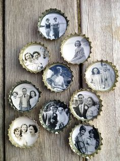 six bottle caps with pictures of people in them on a wooden surface, one is empty