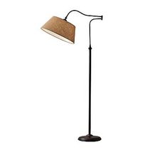 a floor lamp with a brown shade on it's head and a black base