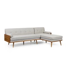 a white couch sitting on top of a wooden frame