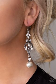 ELEGANTLY EXTRAVAGANT - WHITE An oversized white pearl dangles from the bottom of a flowery silver frame dotted in sections of glassy white rhinestones for an elegant look. Earring attaches to a standard fishhook fitting. Sold as one pair of earrings. P5ST-WTXX-009XX ORDERED 29 JUL 20 CONVENTION EXCLUSIVE 2020 Paparazzi Jewelry Images, Paparazzi Accessories Jewelry, White Pearl Earring, Paparazzi Accessories, Rock Stars, White Rhinestone, Chic Jewelry, Affordable Jewelry, White Earrings