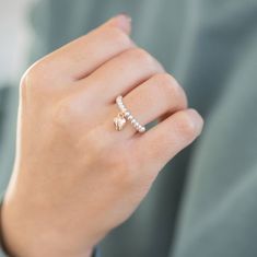 A beautiful silver plated beaded stretch ring with a rose gold puffed heart charm drop. The ring would make the perfect gift for Christmas, a birthday, Valentine's Day, Mother's Day, a special bridesmaid's thank you or for any special gifting occasion. It would also make a lovely treat for yourself. Presented in an organza gift bag with the sentiment card of your choice, ready to give or keep. If you would like to upgrade your purchase to include a gift box please order here: https://www.etsy.co White Rings With Heart Charm For Valentine's Day, White Heart Charm Ring For Valentine's Day, Pink Rings With Heart Charm For Gift, Pink Heart Charm Ring For Gift, Valentine's Day Heart Charm Ring, Bridesmaid Thank You, Stretch Ring, Puffed Heart, Rose Gold Band