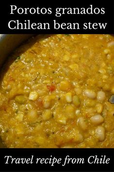 a bowl filled with soup and beans on top of a table