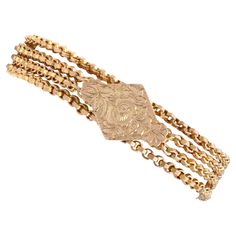 An exceptional, fine and impressive antique Victorian 9 karat yellow gold chain bracelet; part of our diverse antique Victorian jewellery collections. This exceptional, fine and impressive antique Victorian bracelet has been crafted in 9k yellow gold. The double-sided lozenge-shaped face of the bracelet is embellished with impressive paralleling finely engraved scrolling leaf decoration to one side and an exceptional stemmed rose design on a matte background to the other. This anterior portion c Luxury Antique Yellow Gold Chain Bracelet, Matte Background, Victorian Bracelet, Victorian Jewellery, Leaf Decoration, Safety Chain, Leaf Decor, Gold Bracelet Chain, Yellow Gold Chain