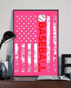 a pink poster with the american flag and baseball ball on it in front of a desk