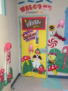 a door decorated with candy, lollipops and other decorations in the hallway