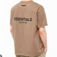 Fear Of God Essentials T-Shirt Features No Branding On The Front Of It. On The Back Of The T-Shirt Is A Black Rubberized Fear Of God Essentials Logo Underneath A Branded Patch. Essentials T Shirt Outfit, Essentials Tshirt, Essentials T Shirt, Essentials Shirt, Summer Drip, God Shirts, God Clothing, Drippy Fits, Retail Trends