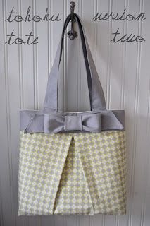 a gray and yellow bag hanging on the wall