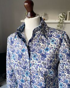 "Hand made Liberty of London floral print Tana Lawn collar shirt with long sleeves contrast collar stand and placket, Laurel Blouse. The Laurel blouse is a simple loose fitting blouse in beautiful liberty print cotton fabric with a Pointed collar and button through front. Inner collar band and placket are made with a contrasting liberty print. Let me know if you are happy for me to choose or if you would like to pick one yourself. Different prints are available so if you see one you would like o Printed Button-up Office Shirt, Blue Collar Top With Floral Print, Classic Floral Print Button-up Top, Elegant Shirt With Floral Print And Spread Collar, Spring Collared Blouse With Placket, Spring Blouse With Placket And Fold Down Collar, Long Sleeve Floral Print Office Blouse, Long Sleeve Floral Print Shirt For Daywear, Office Long Sleeve Floral Print Blouse