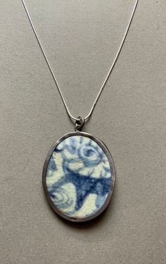 This necklace features a pendant with antique Chinese blue and white porcelain. The porcelain is inlaid in sterling. The chain is new and is also sterling. Blue Oval Enamel Necklace, Chinese Blue And White Porcelain, Chinese Blue, Blue And White Porcelain, Sterling Silver Necklace Pendants, Silver Pendant Necklace, Sterling Silver Pendant, White Porcelain, Sterling Silver Pendants