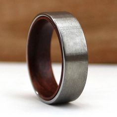 a wedding ring with a wood in the center