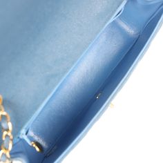 This Vintage Medium Diana Flap Bag is in blue in caviar with gold plated hardware, front flap with CC turnlock closure, single insert back pocket and adjustable interwoven gold plated chain link and Blue caviar leather shoulder/crossbody strap The interior is lined in Blue leather and includes one zip pocket with CC logo pull and one slip pocket on the back wall.Collection: 5-series (1997-1999)Origin: FranceCondition: Vintage; Excellent- This bag retain its shape, no plastic on hardware resultin Chanel Box, Chanel Vintage, Cc Logo, Vuitton Bag, Vintage Chanel, Gold Plated Chains, Flap Bag, Blue Bags, Handbag Backpack